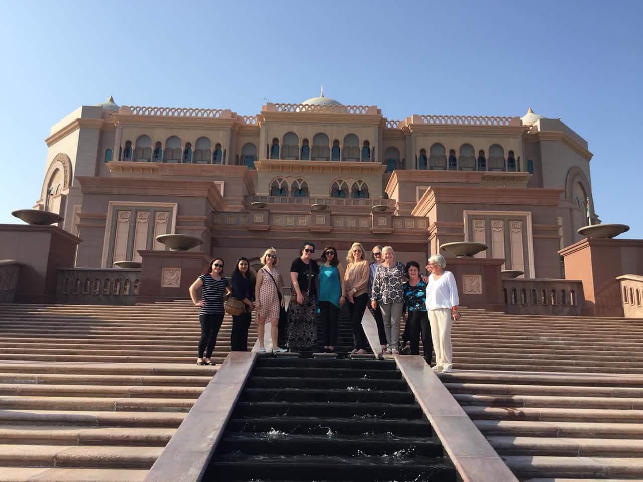 standing outside the Emirates Palace