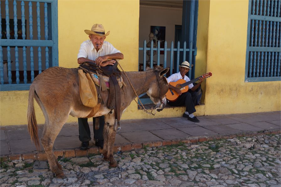 local cuban men with donkey and guitar